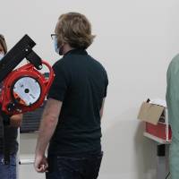 Students work with the lockout/tagout devices